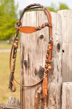 The NWNHC Braided Headstall is available in natural and black to compliment your Western style.